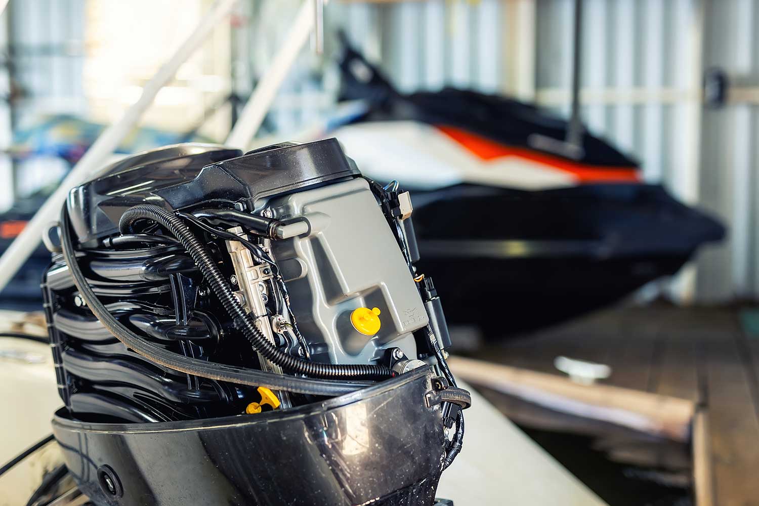 Repairing inflatable motorboat engine at boat garage