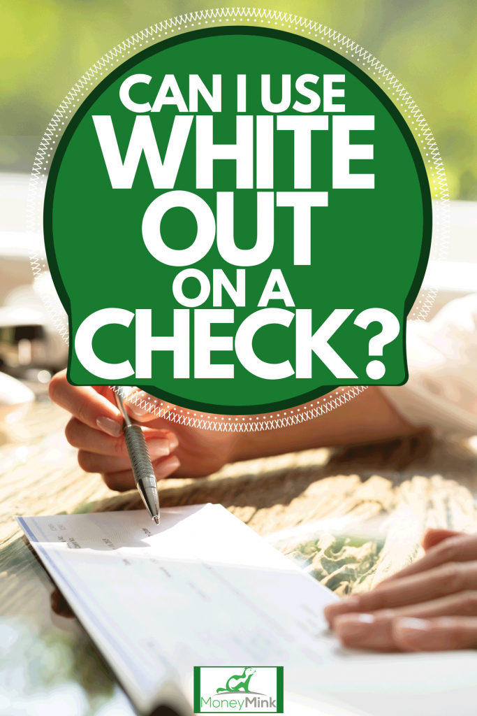 A wealthy business woman filling out a check using a pen, Can I Use White Out On A Check?