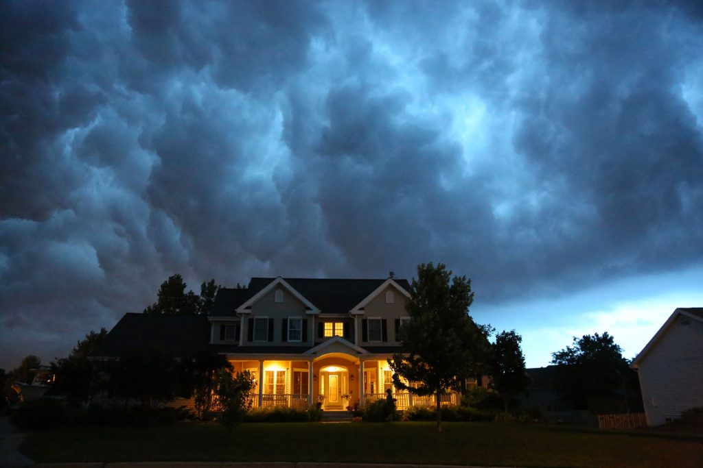 American home with a huge storm gaining energy on the back