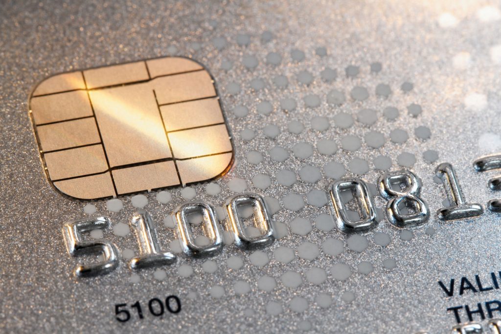 Detailed photo of numbers on a credit card number and chip